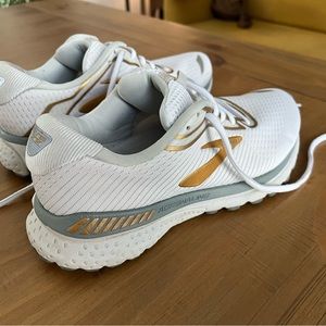 Women’s Gold and White GTS running shoes